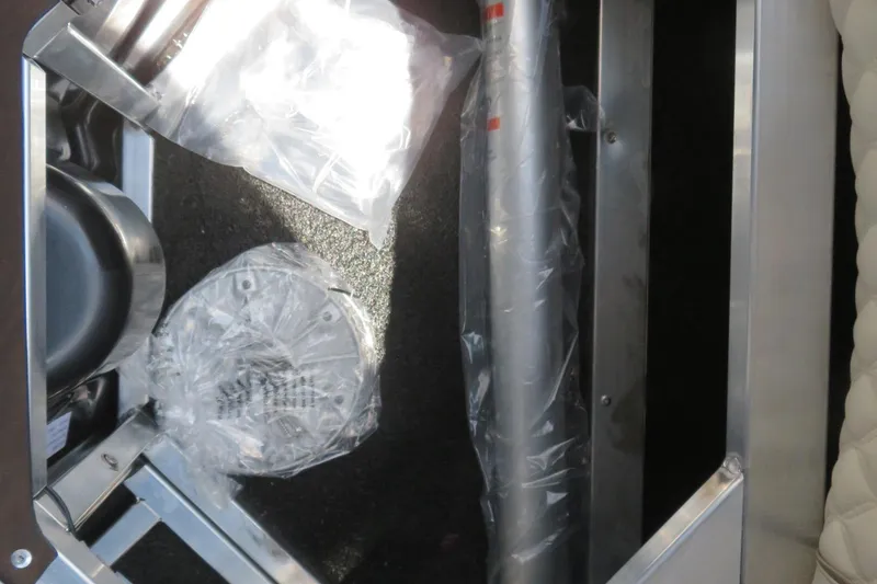 Slide: The Image of 2026 Avalon Excalibur LTD Elite Windshield boat with powerful 400 V10 engine displayed outdoors. - 24