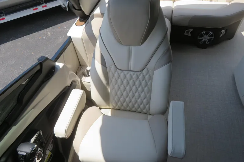 Slide: The Image of Storage compartment in Avalon Excalibur LTD Elite Windshield 2026, featuring beige leather seats. - 47