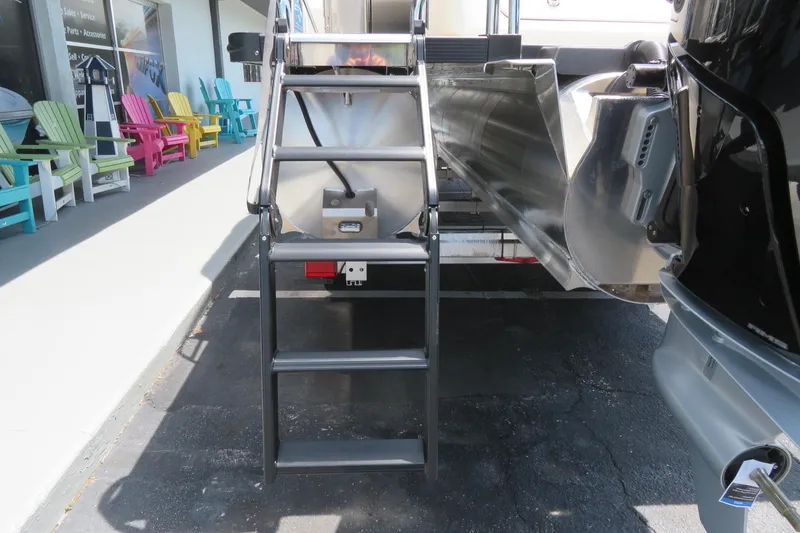 Slide: The Image of 2026 Avalon Excalibur LTD Elite Windshield boat interior with seating and kitchenette. - 69