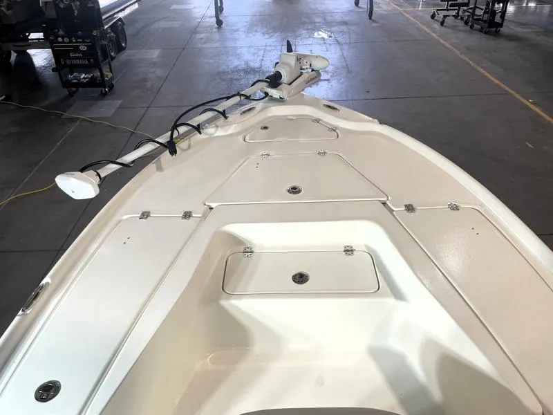 Slide: The Image of 2025 Key West 210 Bay Reef boat deck in a warehouse setting. - 17