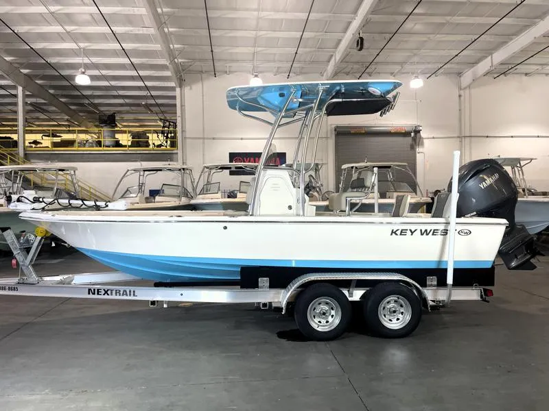 Slide: The Image of 2025 Key West 210 Bay Reef boat on trailer in indoor showroom. - 4