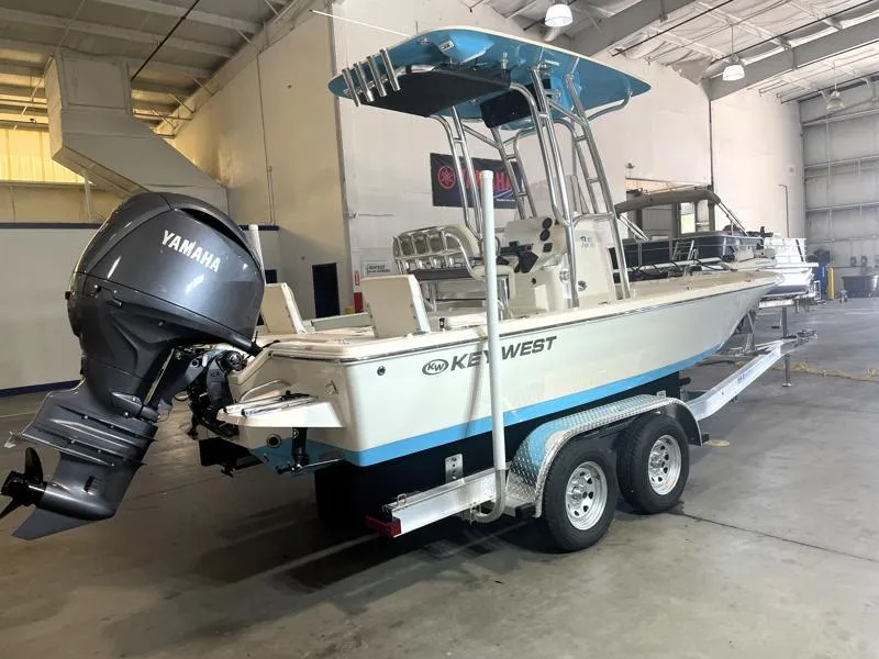 Slide: The Image of 2025 Key West 210 Bay Reef boat with Yamaha engine on trailer in warehouse. - 5