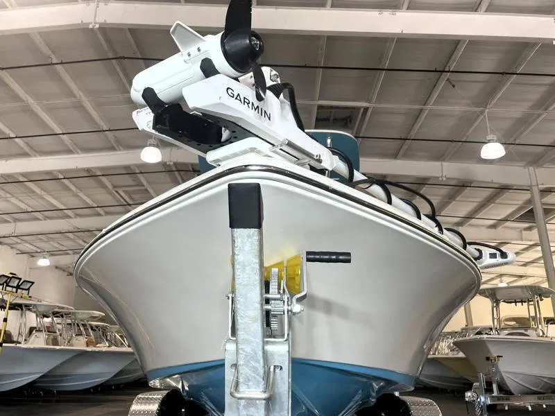 Slide: The Image of 2025 Key West 210 Bay Reef boat with Garmin equipment in a showroom. - 7