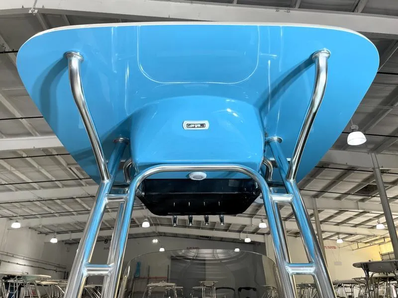 Slide: The Image of 2025 Key West 210 Bay Reef boat with blue T-top and stainless steel frame. - 9