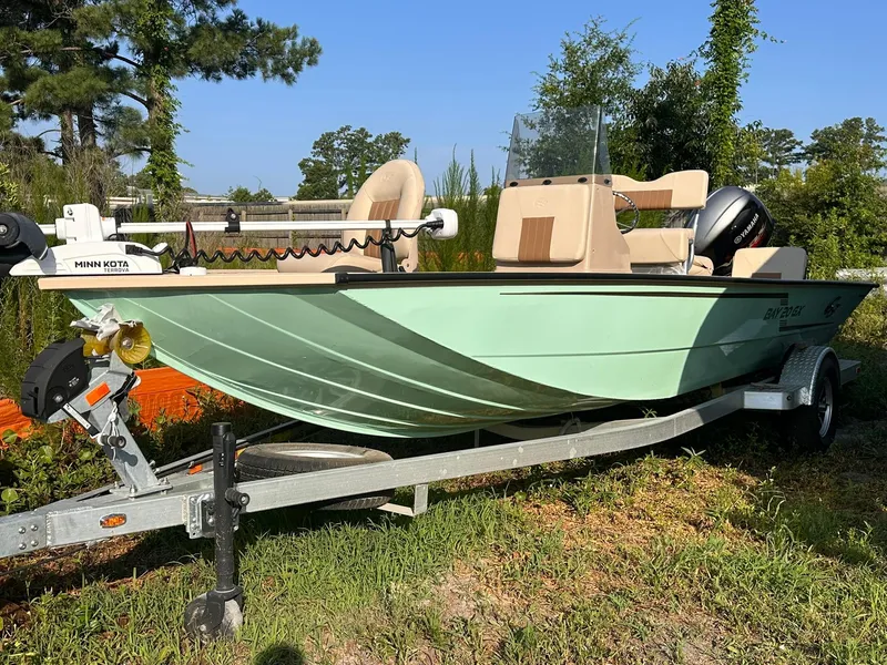 The Image of 2024 G3 Bay 20 GX boat on trailer, featuring Minn Kota motor, parked outdoors. - 0