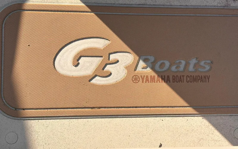 Slide: The Image of G3 Boats logo on a textured surface, Yamaha Boat Company branding, 2024 Bay 20 GX model. - 13