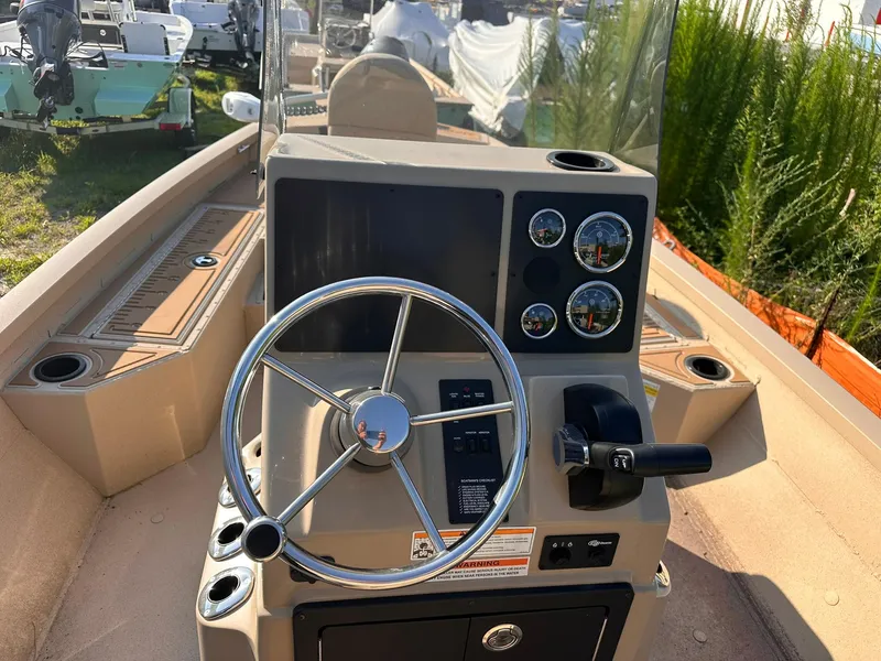 Slide: The Image of 2024 G3 Bay 20 GX boat console with steering wheel and gauges. - 14