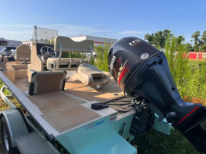 Slide: The Image of 2024 G3 Bay 20 GX boat with Yamaha 115 engine, parked outdoors. - 15