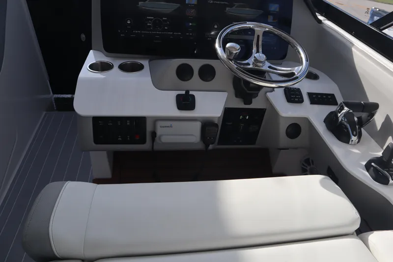 Slide: The Image of 2022 Regal LX36 boat cockpit with steering wheel and control panel. - 15