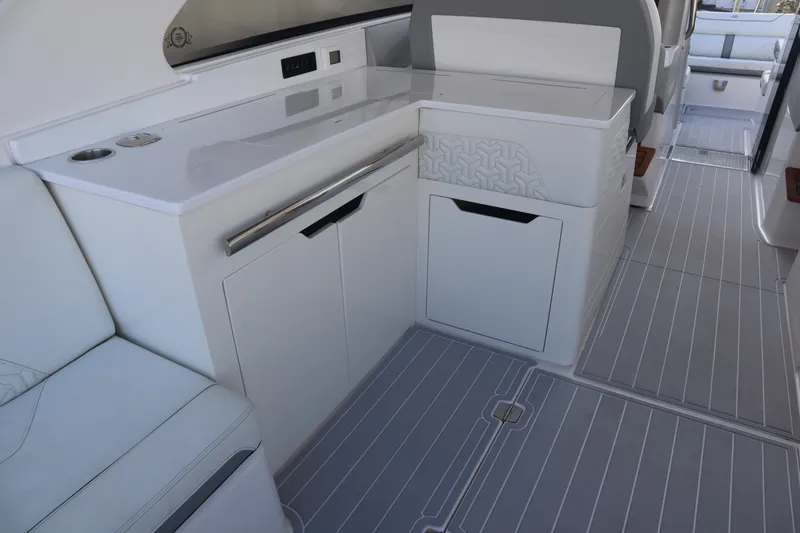 Slide: The Image of 2022 Regal LX36 boat interior with sleek white cabinetry and modern design. - 36