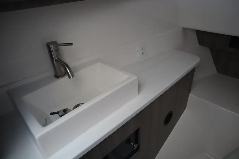 Slide: The Image of Modern bathroom sink in 2022 Regal LX36 boat, featuring sleek faucet and minimalist design. - 38