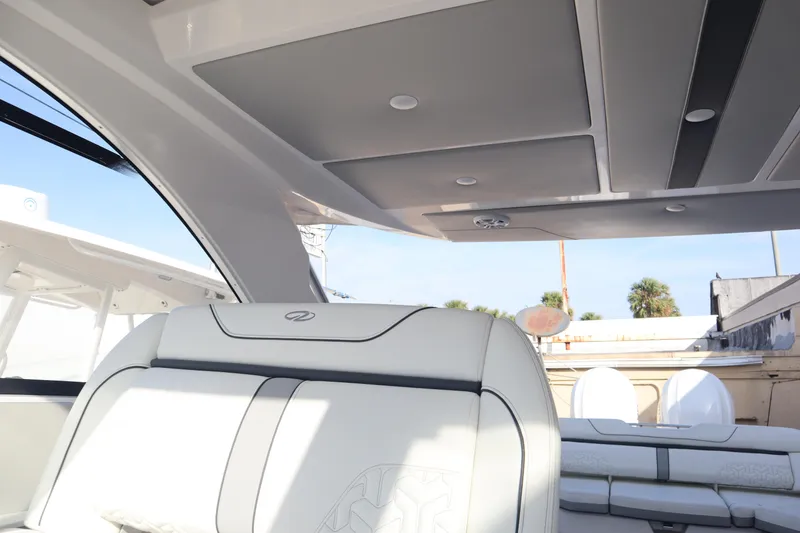 Slide: The Image of Interior of 2022 Regal LX36 boat with luxurious seating and modern design. - 45