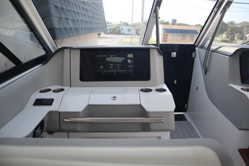 Slide: The Image of Interior cockpit of 2022 Regal LX36 boat with modern dashboard and controls. - 8