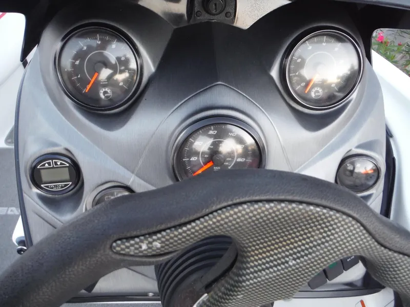 Slide: The Image of 2012 Sea-Doo Sport Boats 200 Speedster dashboard with gauges and steering wheel. - 12