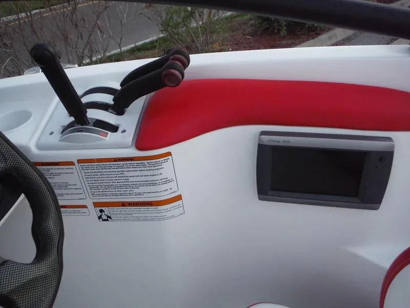 Slide: The Image of 2012 Sea-Doo 200 Speedster dashboard with controls and GPS unit. - 13
