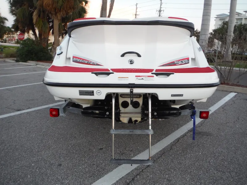 Slide: The Image of 2012 Sea-Doo Sport Boats 200 Speedster rear view in parking lot. - 3