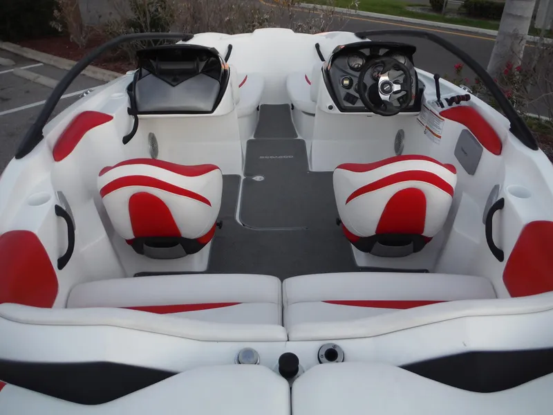 Slide: The Image of 2012 Sea-Doo Sport Boats 200 Speedster interior with red and white seating, steering console. - 6