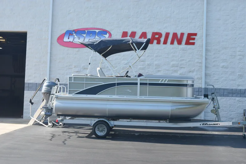 The Image of 2021 Bennington 18 SLX pontoon boat on trailer at GSPS Marine dealership. - 1