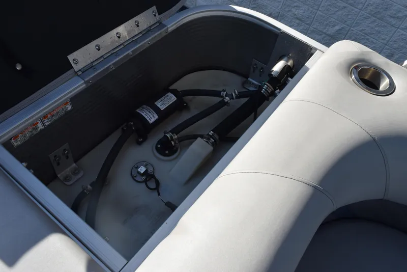 Slide: The Image of Storage compartment of a 2021 Bennington 18 SLX boat, showing internal components and wiring. - 15