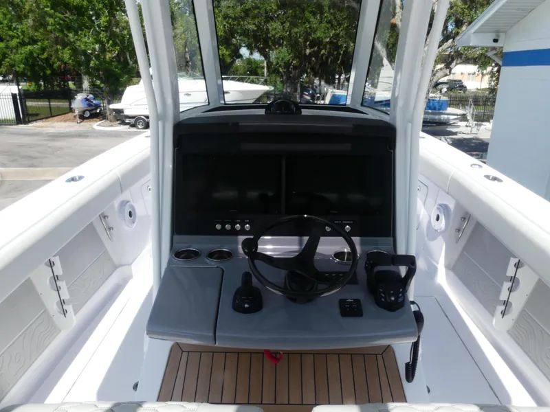 Slide: The Image of 2026 Jupiter 340LS boat helm with modern controls and sleek design. - 15