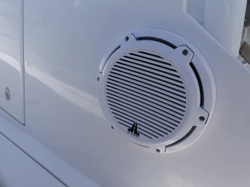 Slide: The Image of White JL Audio speaker on Jupiter 340LS boat, model year 2026. - 35