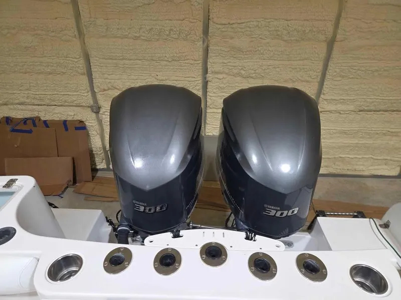 Slide: The Image of Twin Yamaha 300 outboard engines on a 2013 Sailfish 290 CC boat. - 9