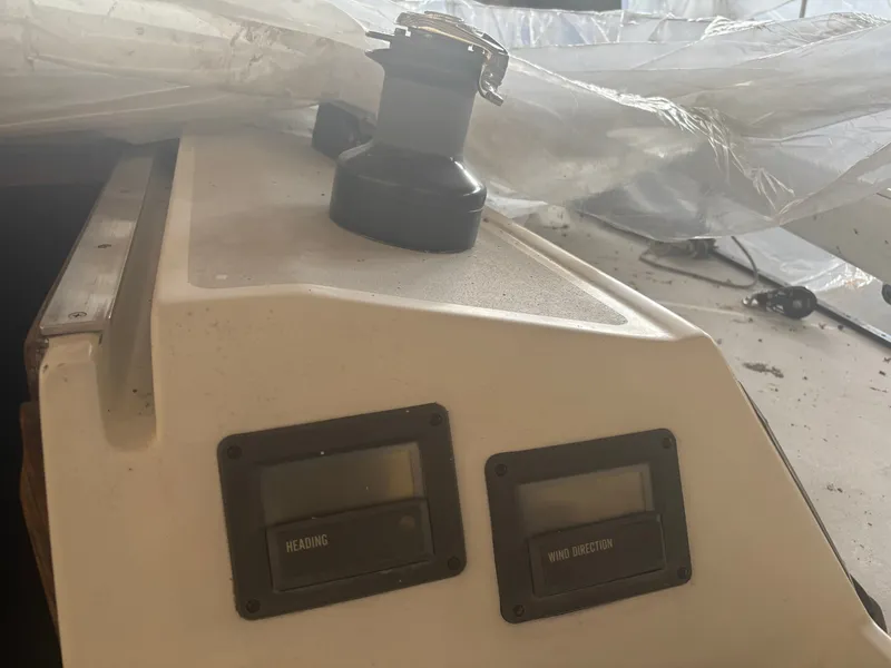 Slide: The Image of 1987 Holby Tripp boat console with heading and wind direction displays. - 30