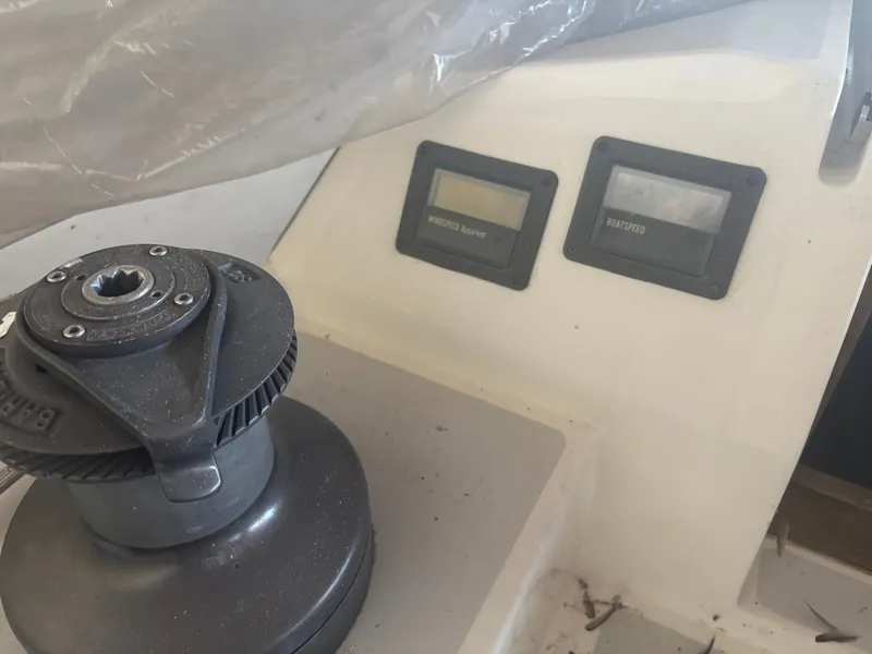 Slide: The Image of 1987 Holby Tripp boat dashboard with winch and speed gauges. - 36