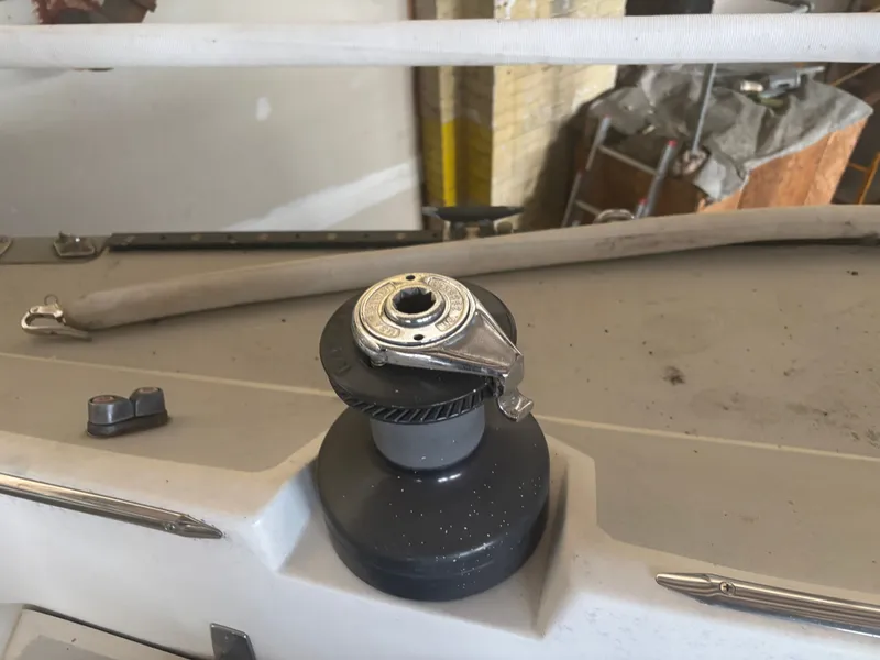 Slide: The Image of Winch on 1987 Holby Tripp sailboat deck, featuring nautical equipment and fittings. - 38