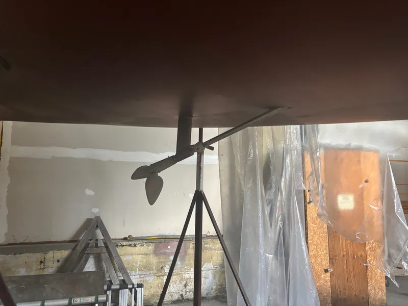 Slide: The Image of 1987 Holby Tripp boat propeller in a workshop setting. - 8