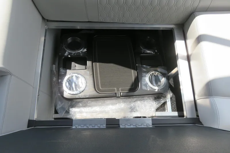 Slide: The Image of Avalon 2385 LSZ Quad Lounger storage compartment with cup holders, 2026 model, Sarasota, FL. - 55