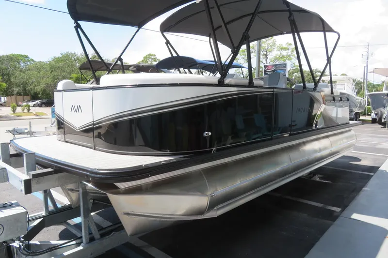 Slide: The Image of 2026 Avalon 2385 LSZ Quad Lounger luxury tri-toon boat in Sarasota, FL, on a trailer. - 6
