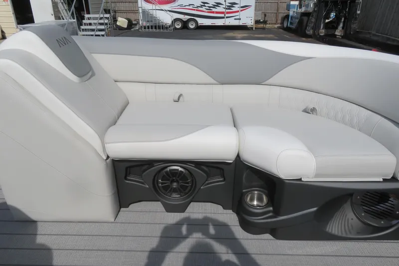 Slide: The Image of Luxurious seating on 2026 Avalon 2385 LSZ Quad Lounger Tri-toon, featuring premium upholstery and speaker system. - 11