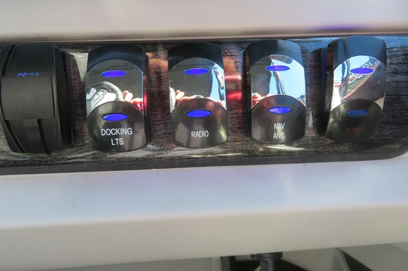 Slide: The Image of Control panel of 2026 Avalon 2385 LSZ Quad Lounger with illuminated switches. - 28