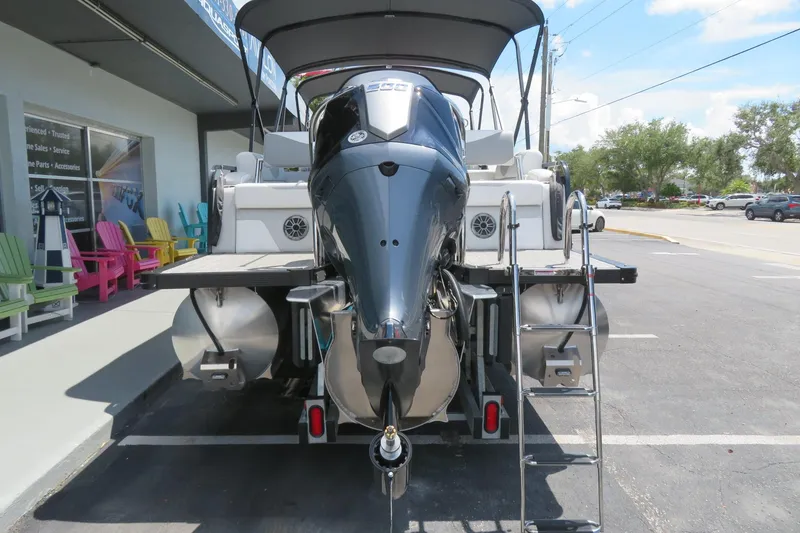 Slide: The Image of 2026 Avalon 2385 LSZ Quad Lounger Tri-toon boat, rear view, Sarasota, FL dealership. - 3