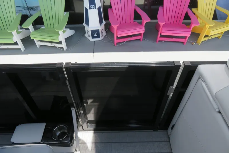 Slide: The Image of Colorful Adirondack chairs on a dock beside Avalon 2385 LSZ Quad Lounger, Sarasota, FL. - 48