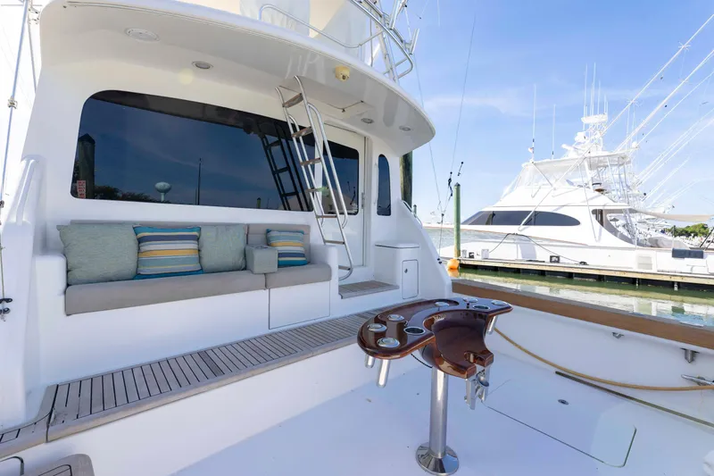 Slide: The Image of 2008 Ocean Yachts 54 Super Sport yacht with cushioned seating and fishing rod holders. - 10