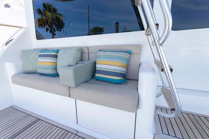 Slide: The Image of Luxury seating area on 2008 Ocean Yachts 54 Super Sport with striped cushions. - 12