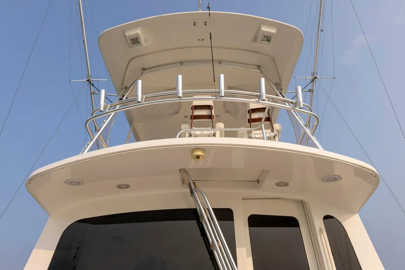 Slide: The Image of 2008 Ocean Yachts 54 Super Sport, view of upper deck and tower against blue sky. - 13