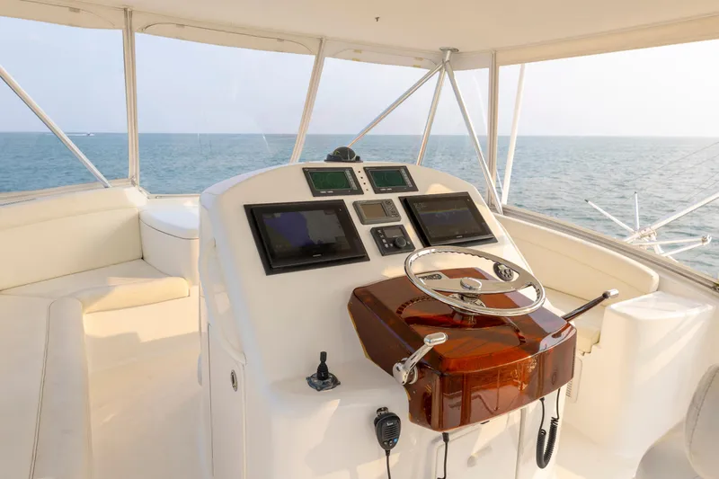 Slide: The Image of Helm of 2008 Ocean Yachts 54 Super Sport, featuring modern navigation equipment and ocean view. - 14
