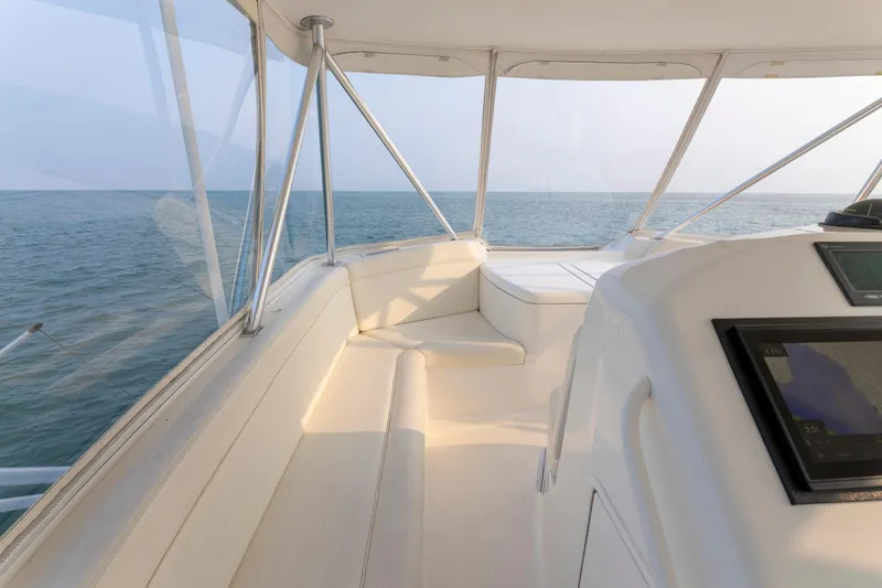 Slide: The Image of Interior view of 2008 Ocean Yachts 54 Super Sport, featuring spacious seating and ocean backdrop. - 17