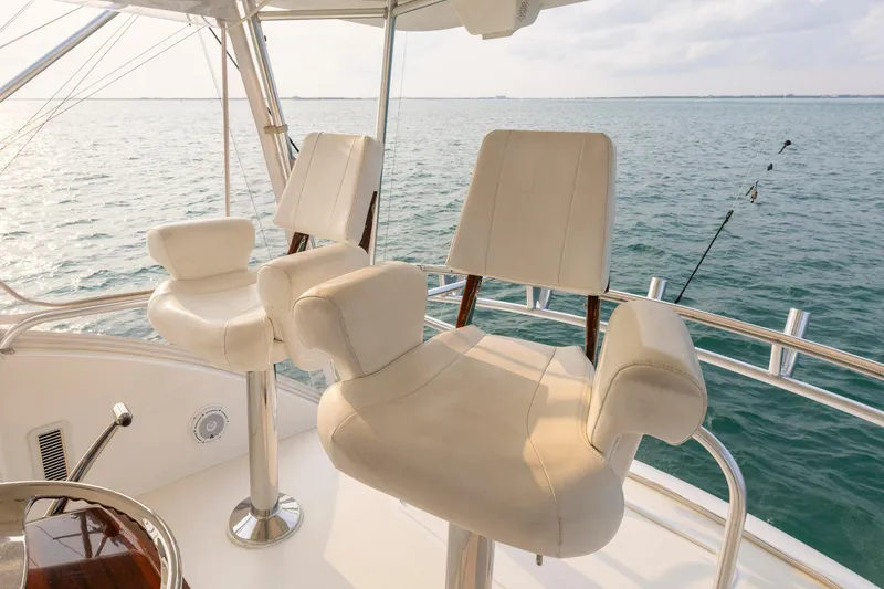 Slide: The Image of Luxury seating on 2008 Ocean Yachts 54 Super Sport, overlooking serene ocean waters. - 18