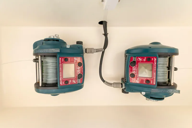 Slide: The Image of Electric fishing reels on a 2008 Ocean Yachts 54 Super Sport boat. - 19