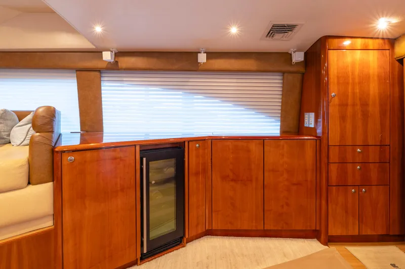 Slide: The Image of Luxurious interior of 2008 Ocean Yachts 54 Super Sport with wood cabinetry and mini fridge. - 24