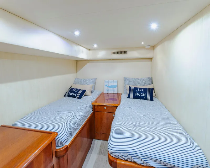 Slide: The Image of Twin beds in a cozy cabin of a 2008 Ocean Yachts 54 Super Sport. - 27