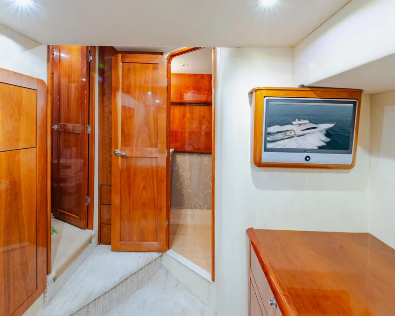 Slide: The Image of Luxurious interior of 2008 Ocean Yachts 54 Super Sport with wood finishes and TV display. - 28