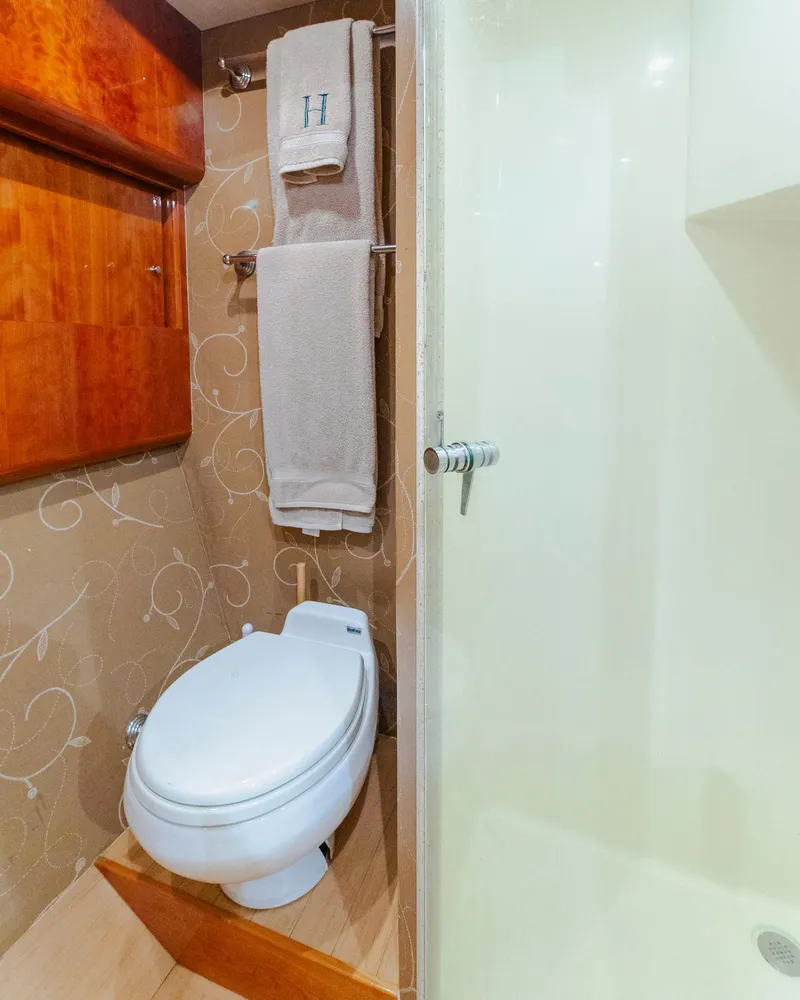 Slide: The Image of Luxurious bathroom in 2008 Ocean Yachts 54 Super Sport with elegant wood accents and modern fixtures. - 29