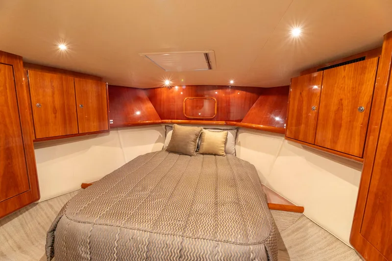 Slide: The Image of Luxurious cabin interior of 2008 Ocean Yachts 54 Super Sport with wood cabinetry and cozy bedding. - 31