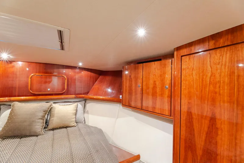 Slide: The Image of Luxurious cabin interior of 2008 Ocean Yachts 54 Super Sport with wood finish and cozy bedding. - 33