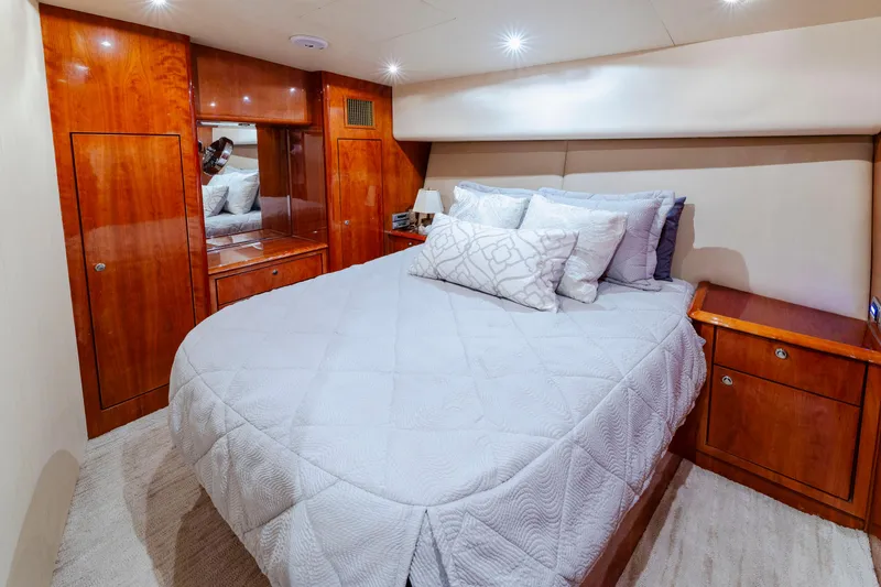 Slide: The Image of Luxurious bedroom interior of 2008 Ocean Yachts 54 Super Sport with elegant wood finishes. - 34